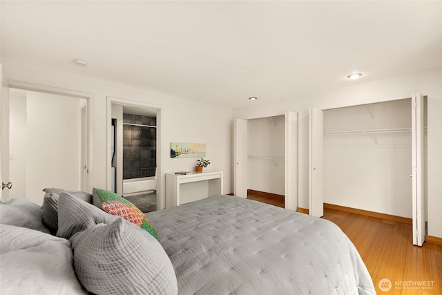 500 Aloha St Unit 202, Seattle, WA 98109 - bedroom with two closets and wood finished floors