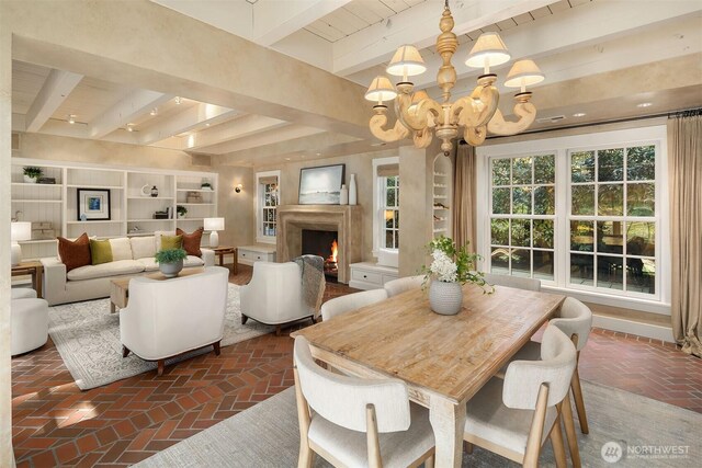 1135 Evergreen Point Rd, Medina, WA 98039 - dining space featuring brick floors, a chandelier, a wooden ceiling with exposed beams, and a premium fireplace