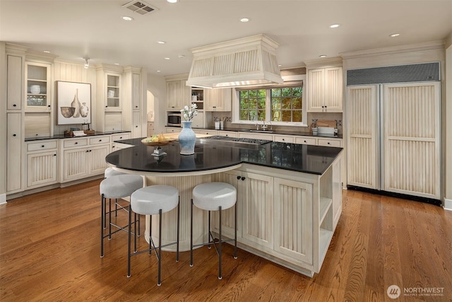 1135 Evergreen Point Rd, Medina, WA 98039 - kitchen featuring paneled refrigerator, dark countertops, open shelves, wood finished floors, and recessed lighting