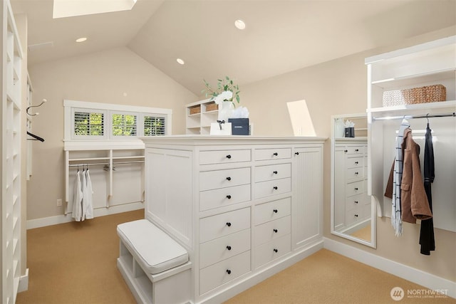 1135 Evergreen Point Rd, Medina, WA 98039 - walk in closet with light carpet, a skylight, and lofted ceiling