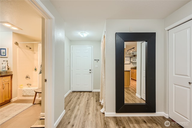 3045 20th Ave W Unit 108, Seattle, WA 98199 - corridor with light wood-type flooring and baseboards