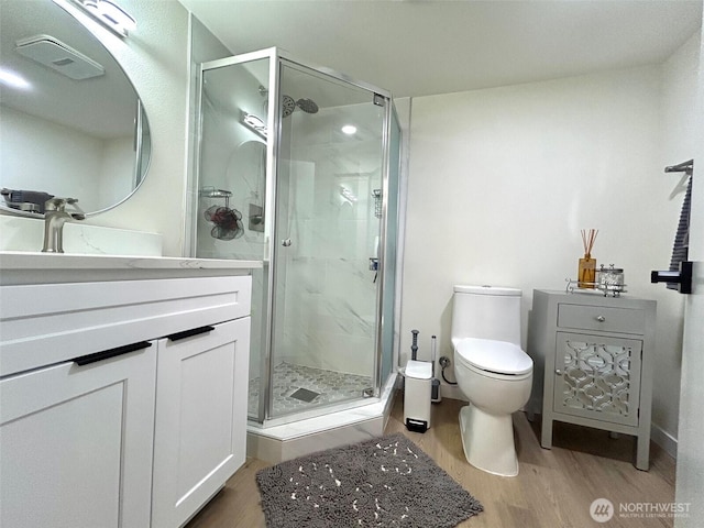 7353 29th Ave SW, Seattle, WA 98126 - full bath featuring vanity, wood finished floors, and a stall shower