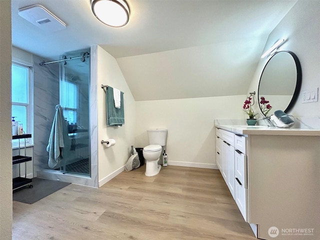 7353 29th Ave SW, Seattle, WA 98126 - full bath featuring vanity, a shower stall, wood finished floors, and vaulted ceiling