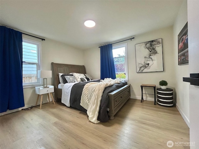 7353 29th Ave SW, Seattle, WA 98126 - bedroom featuring light wood finished floors and baseboards