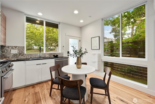 2439 NW 61st St Unit A, Seattle, WA 98107 - dining area with light wood-style flooring and recessed lighting