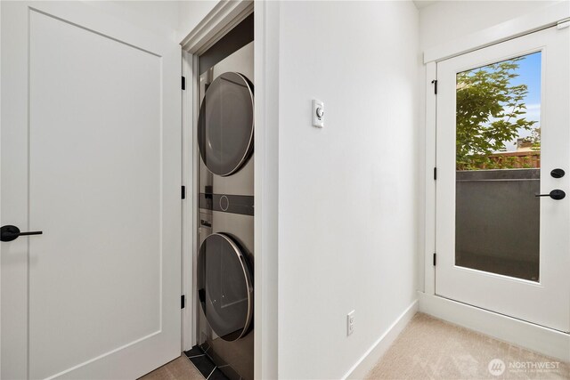 2439 NW 61st St Unit A, Seattle, WA 98107 - washroom with stacked washer / dryer and baseboards