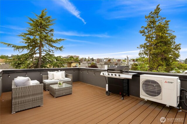 2439 NW 61st St Unit A, Seattle, WA 98107 - wooden deck with grilling area and outdoor lounge area