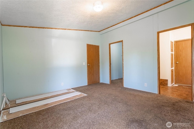 19412 Vantage Ln, Onalaska, WA 98570 - unfurnished room with crown molding, carpet floors, and a textured ceiling