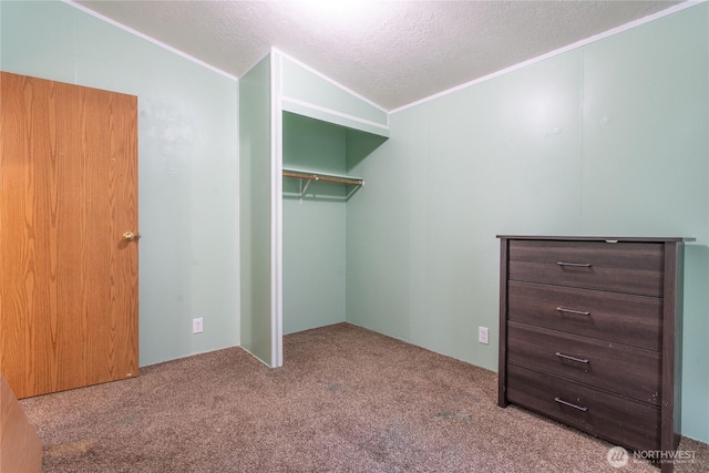 19412 Vantage Ln, Onalaska, WA 98570 - unfurnished bedroom with carpet floors, vaulted ceiling, a closet, ornamental molding, and a textured ceiling