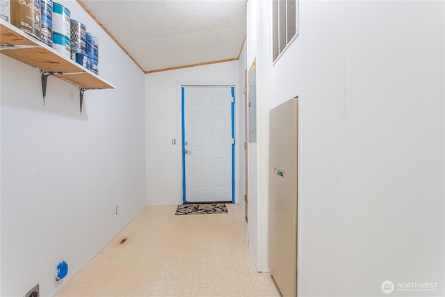 19412 Vantage Ln, Onalaska, WA 98570 - hallway with tile patterned floors, lofted ceiling, and a textured ceiling