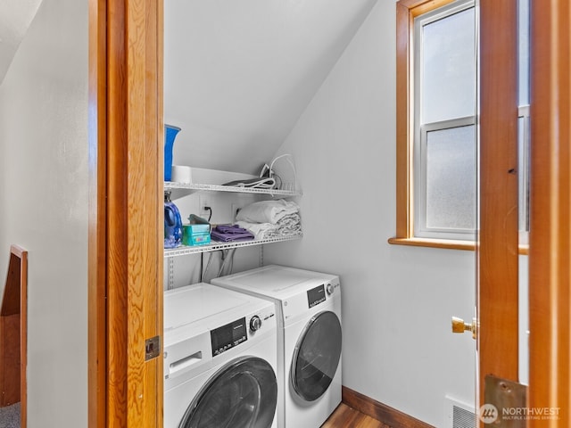 139 Maple St, Camano Island, WA 98282 - laundry room with washing machine and dryer and wood finished floors