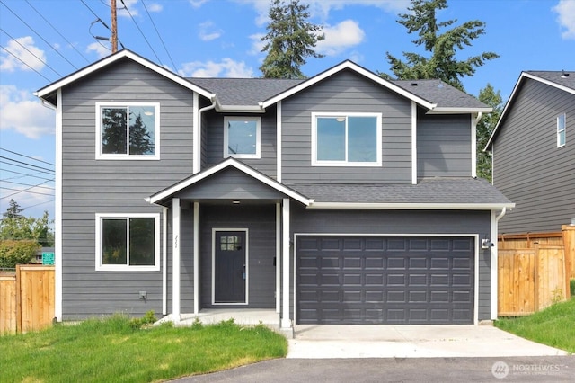 711 S 96th St, Tacoma, WA 98444 - view of front of home with an attached garage, driveway, and roof with shingles