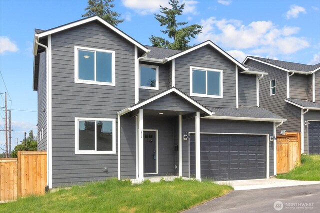 711 S 96th St, Tacoma, WA 98444 - view of front of house featuring an attached garage and asphalt driveway