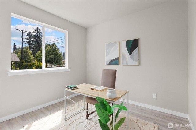 711 S 96th St, Tacoma, WA 98444 - home office with light wood-style flooring and baseboards