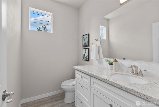 711 S 96th St, Tacoma, WA 98444 - bathroom with vanity and wood finished floors