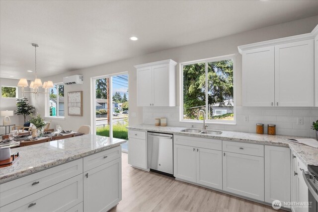 711 S 96th St, Tacoma, WA 98444 - kitchen with dishwasher, backsplash, healthy amount of natural light, white cabinetry, and recessed lighting