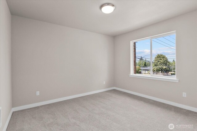 711 S 96th St, Tacoma, WA 98444 - unfurnished room featuring carpet flooring and baseboards