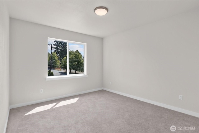 711 S 96th St, Tacoma, WA 98444 - carpeted spare room with baseboards