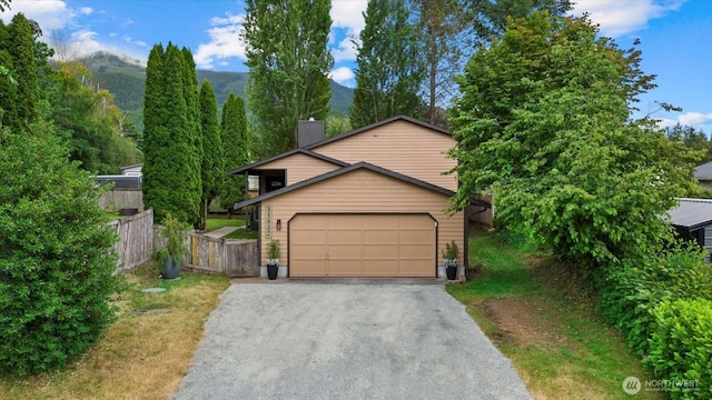 35632 158th St SE, Sultan, WA 98294 - view of front facade featuring a chimney and driveway