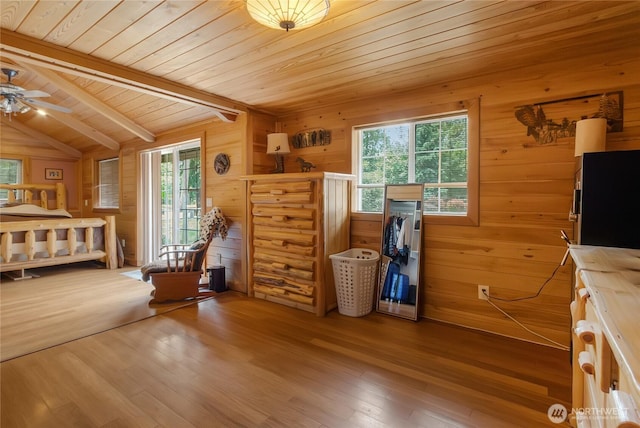 19127 Patterson Rd E, Orting, WA 98360 - bedroom featuring wooden walls, hardwood / wood-style floors, and wooden ceiling