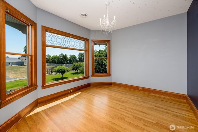 11801 Rd 5.6 NE, Moses Lake, WA 98837 - spare room featuring a chandelier and light wood-type flooring