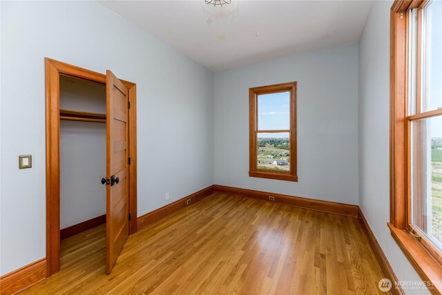11801 Rd 5.6 NE, Moses Lake, WA 98837 - unfurnished bedroom featuring baseboards and light wood-type flooring