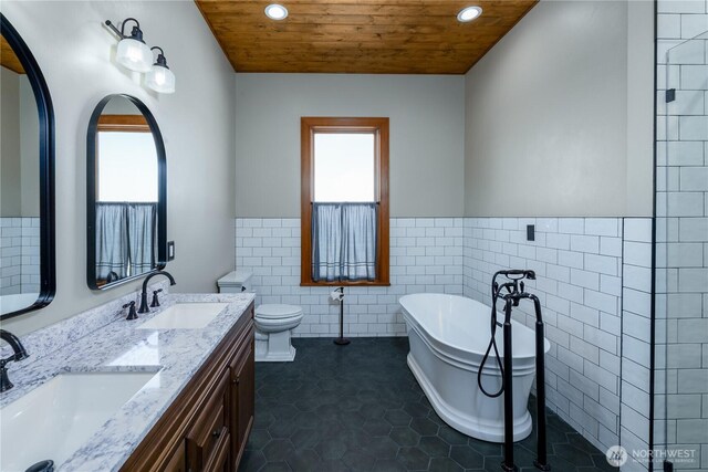 11801 Rd 5.6 NE, Moses Lake, WA 98837 - full bath with tile walls, wood ceiling, recessed lighting, a soaking tub, and a wainscoted wall