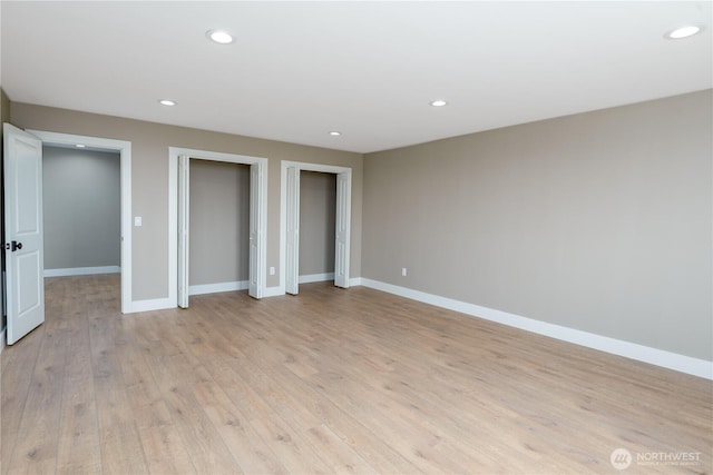 11801 Rd 5.6 NE, Moses Lake, WA 98837 - unfurnished bedroom with multiple closets, light wood finished floors, and recessed lighting