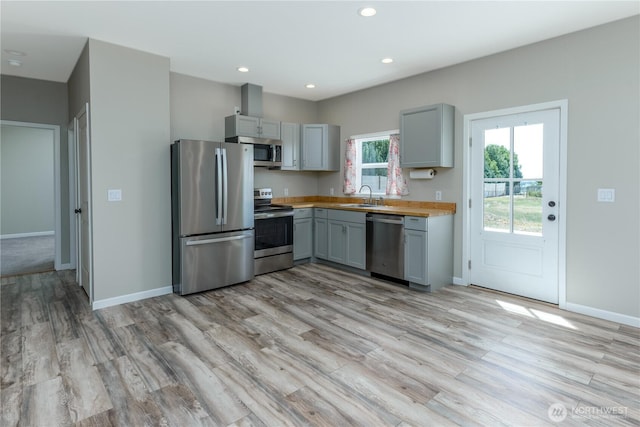 11801 Rd 5.6 NE, Moses Lake, WA 98837 - kitchen with stainless steel appliances, gray cabinetry, light countertops, light wood finished floors, and recessed lighting