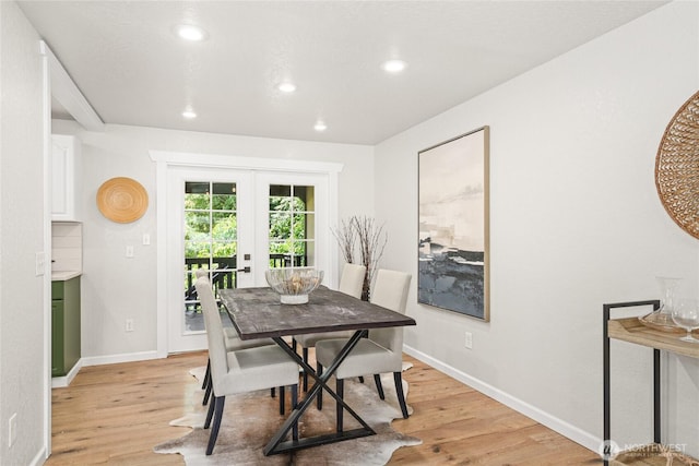 13045 28th Ave NE, Seattle, WA 98125 - dining space featuring french doors, light wood finished floors, and recessed lighting