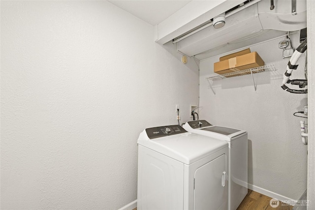 13045 28th Ave NE, Seattle, WA 98125 - laundry area featuring separate washer and dryer and wood finished floors