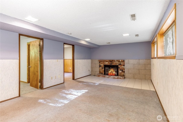8419 121st St E, Puyallup, WA 98373 - finished below grade area featuring carpet floors, a wainscoted wall, and a brick fireplace