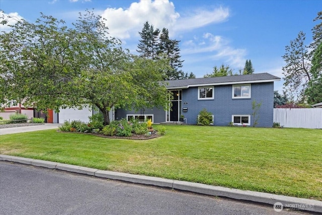 4128 S Lee St, Spokane, WA 99203 - bi-level home with a garage, concrete driveway, and brick siding