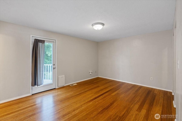 4128 S Lee St, Spokane, WA 99203 - unfurnished room featuring wood finished floors and a textured ceiling