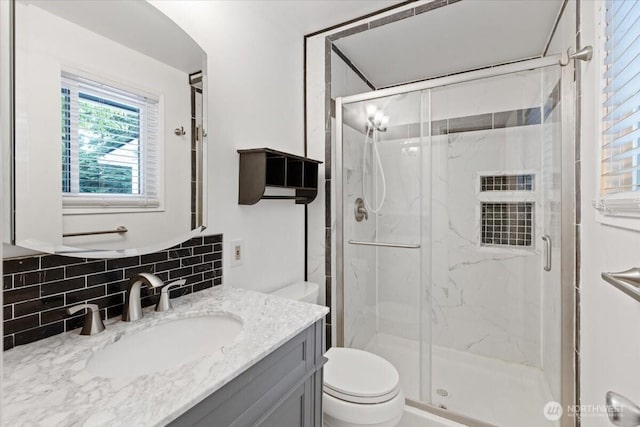 4128 S Lee St, Spokane, WA 99203 - bathroom with vanity, tasteful backsplash, and a marble finish shower