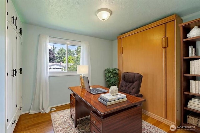 4128 S Lee St, Spokane, WA 99203 - home office featuring light wood finished floors and a textured ceiling