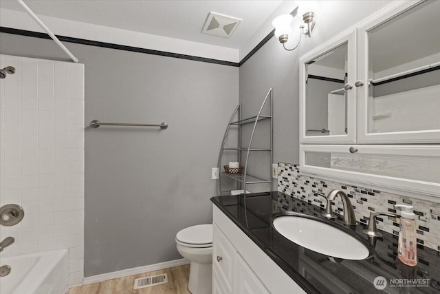 4128 S Lee St, Spokane, WA 99203 - full bathroom featuring backsplash, vanity, and bathtub / shower combination