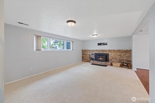 4128 S Lee St, Spokane, WA 99203 - unfurnished living room with a brick fireplace and baseboards
