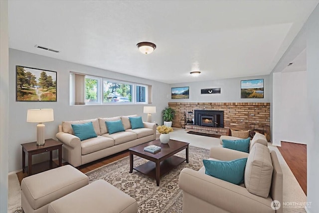 4128 S Lee St, Spokane, WA 99203 - living room featuring a brick fireplace and wood finished floors