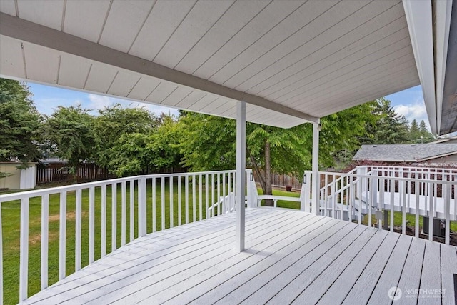 4128 S Lee St, Spokane, WA 99203 - deck with a fenced backyard, an outbuilding, and view of wooded area