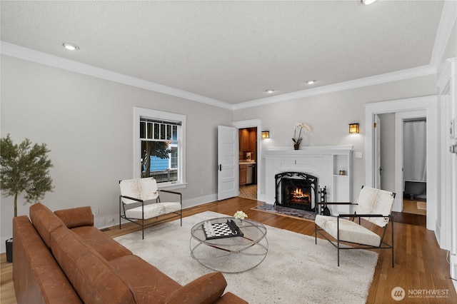 6903 Fauntleroy Way SW, Seattle, WA 98136 - living room with a fireplace with flush hearth, wood finished floors, crown molding, and recessed lighting