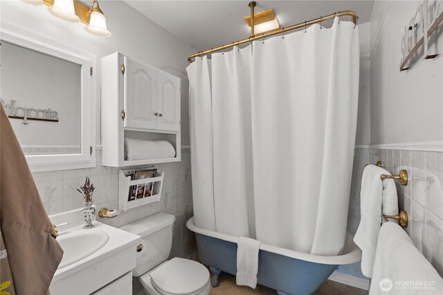 6903 Fauntleroy Way SW, Seattle, WA 98136 - bathroom with tile walls, vanity, and a wainscoted wall