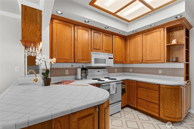 6903 Fauntleroy Way SW, Seattle, WA 98136 - kitchen featuring white appliances, brown cabinetry, tasteful backsplash, and recessed lighting