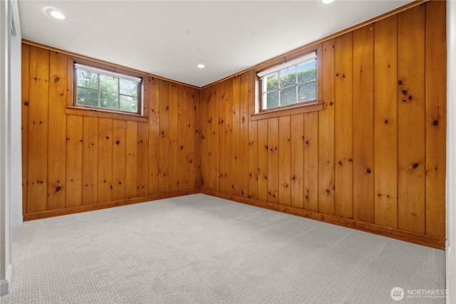 6903 Fauntleroy Way SW, Seattle, WA 98136 - unfurnished room with healthy amount of natural light, carpet floors, recessed lighting, and wooden walls