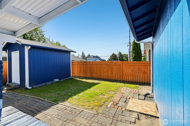 4715 S Cushman Ave, Tacoma, WA 98408 - fenced backyard featuring a patio area and a shed