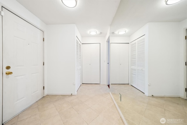 5813 S 238th Ct Unit F2, Kent, WA 98032 - entryway featuring baseboards and light tile patterned floors