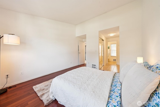 5813 S 238th Ct Unit F2, Kent, WA 98032 - bedroom with wood finished floors and ensuite bath