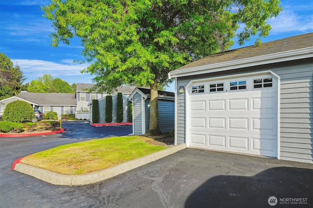 5813 S 238th Ct Unit F2, Kent, WA 98032 - garage featuring driveway