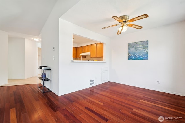 5813 S 238th Ct Unit F2, Kent, WA 98032 - unfurnished living room featuring a ceiling fan and wood finished floors
