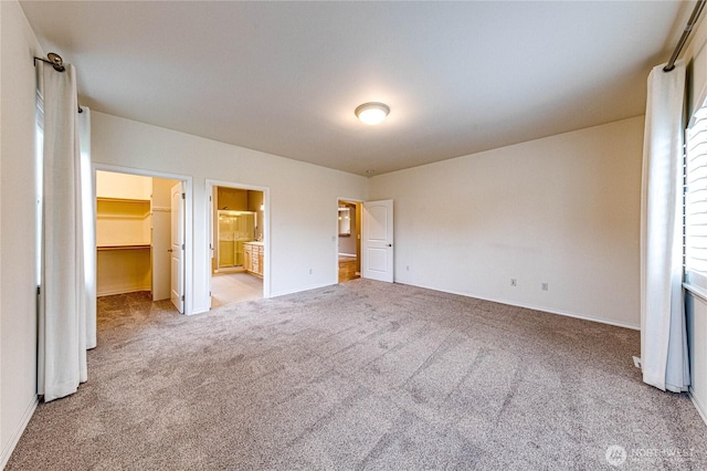 120 Petal Ln, Sequim, WA 98382 - unfurnished bedroom with a spacious closet, carpet, ensuite bath, and a closet